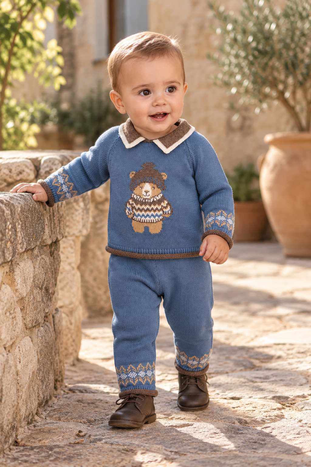 Toddler boy wearing the Foque La Cabana blue bear knitted trouser set in Spain