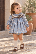 Toddler girl wearing the Foque La Cabana blue bear dress and matching knickers in Spain