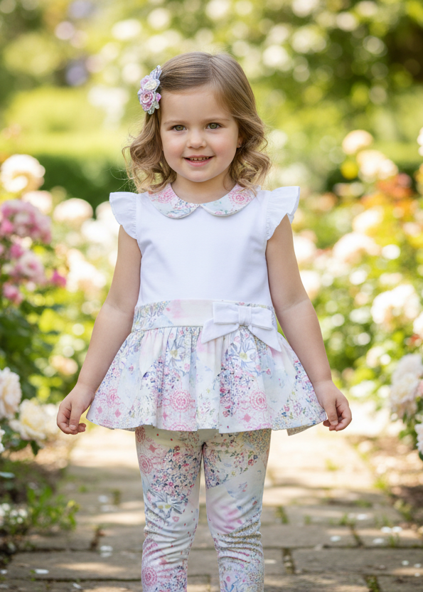 Full-length little girl in floral outfit with full-length leggings