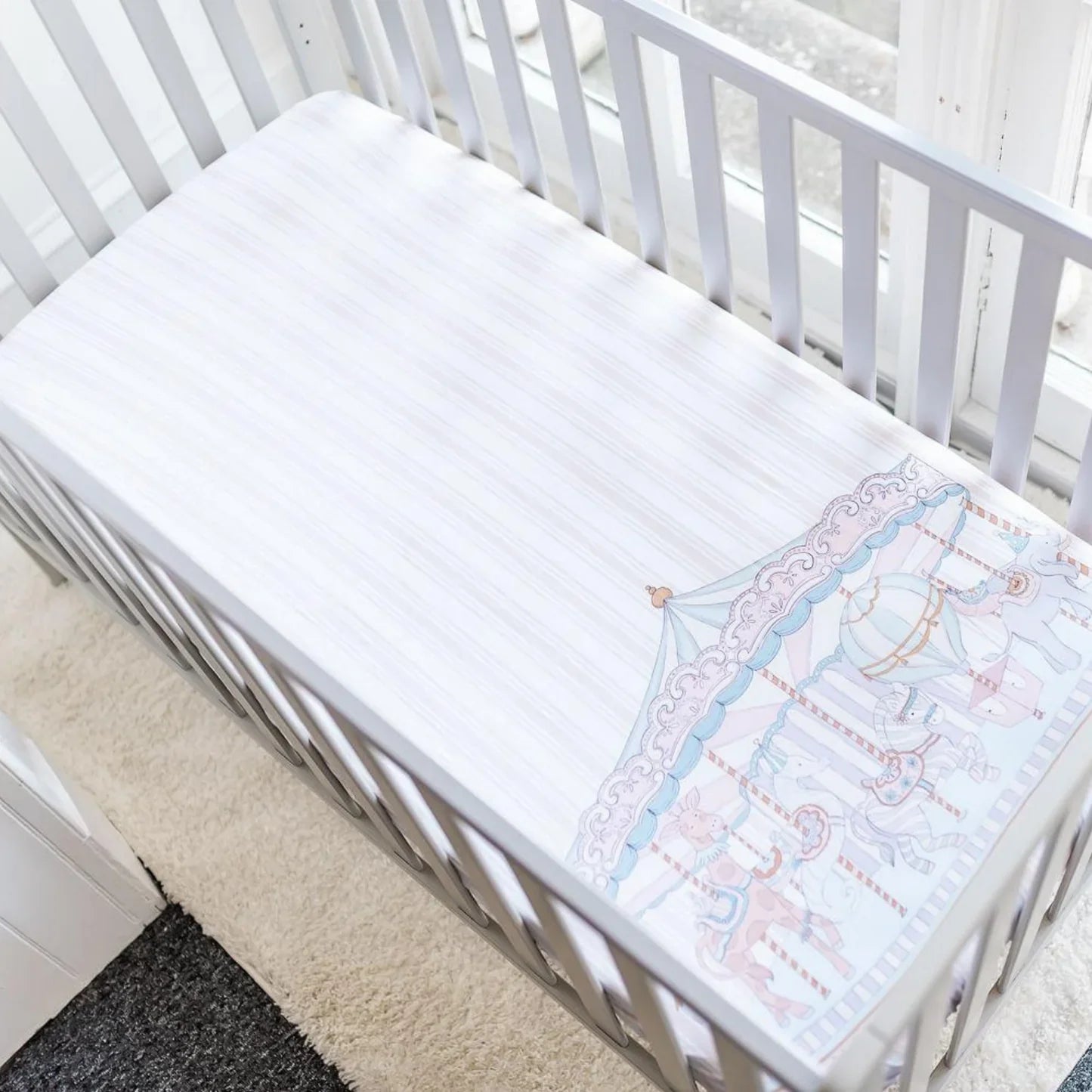 THE GILDED BIRD Carousel Fitted Cot Sheet