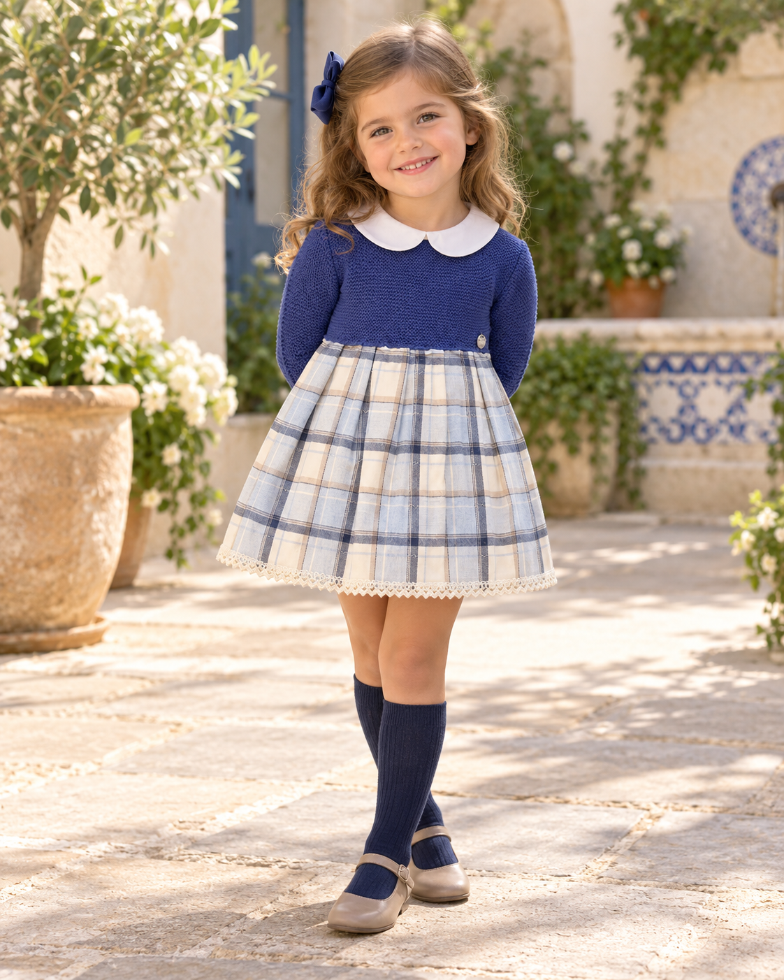 Girl wearing the Juliana Azulina blue knitted dress with checked skirt