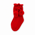 Juliana Melodia red knitted pom-pom sock on a white background