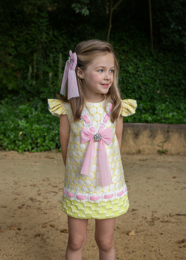Little girl in lime green and pink Naxos dress
