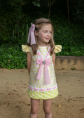 Little girl in lime green and pink Naxos dress