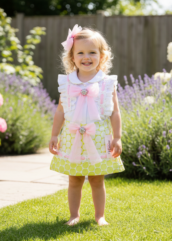 Little girl in pink and lime skirt and blouse set