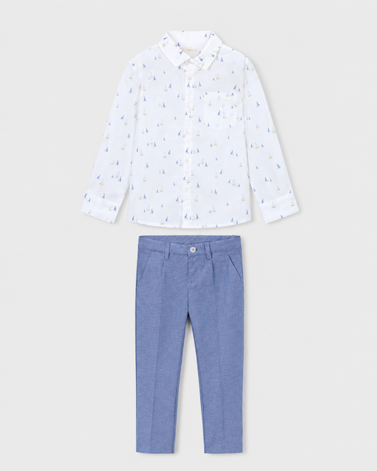 Flat lay of the Mayoral white boat-print shirt and Capri-blue trousers outfit