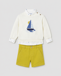 Flat lay of the Mayoral sailboat jumper, boat-print shirt and Capri-yellow shorts outfit