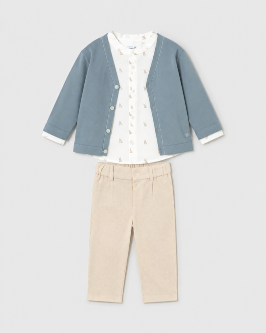 Flat lay of the Mayoral jade cardigan, ivory printed shirt and beige checked trousers outfit