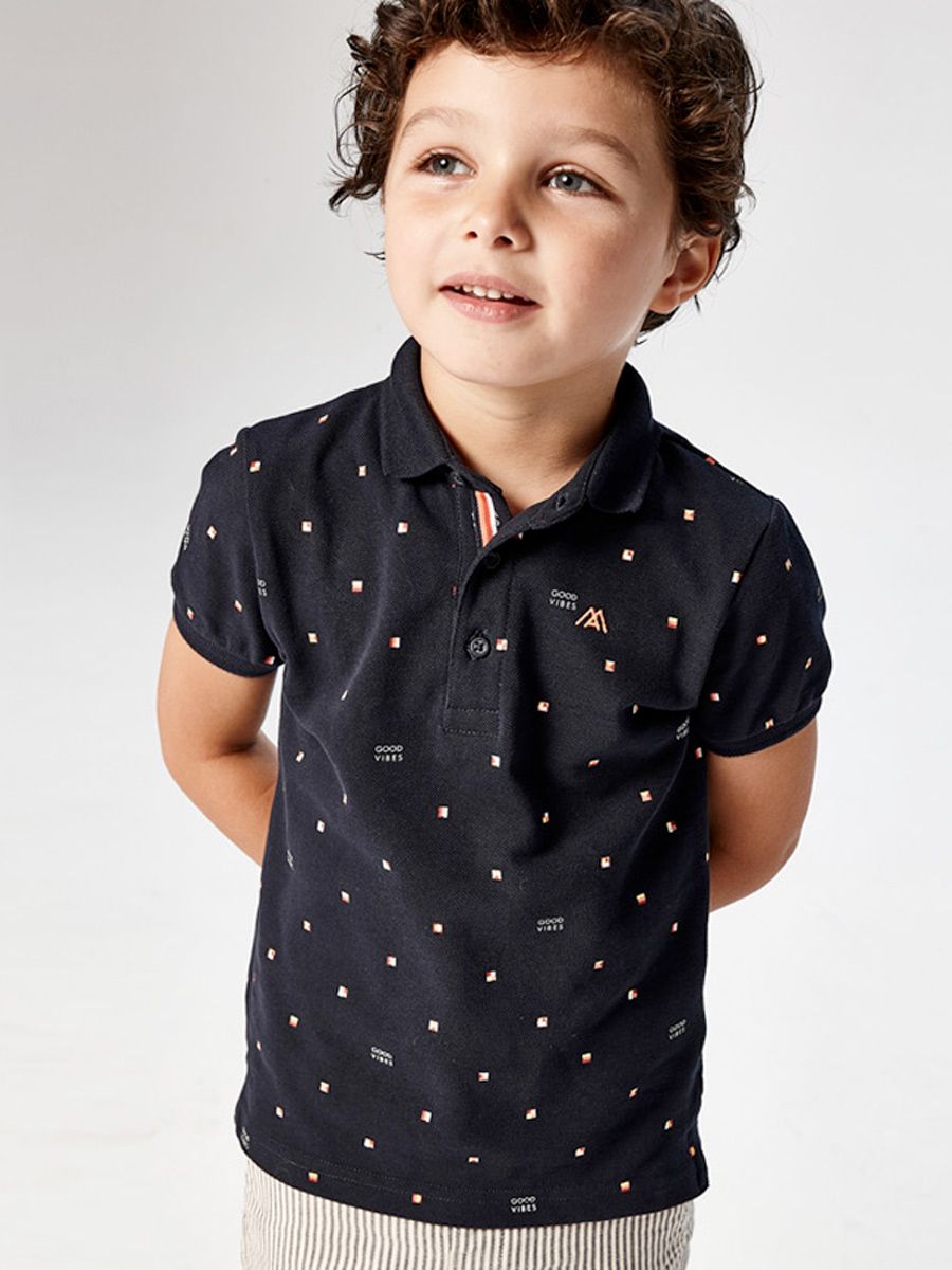 Boy wearing Mayoral navy Good Vibes short sleeve polo shirt