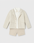 Flat lay of the Mayoral long-sleeved oat cardigan, ivory shirt and checked shorts outfit