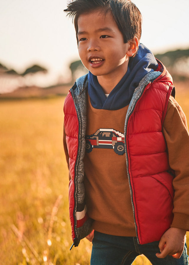 Boy wearing Mayoral red and grey reversible hooded gilet