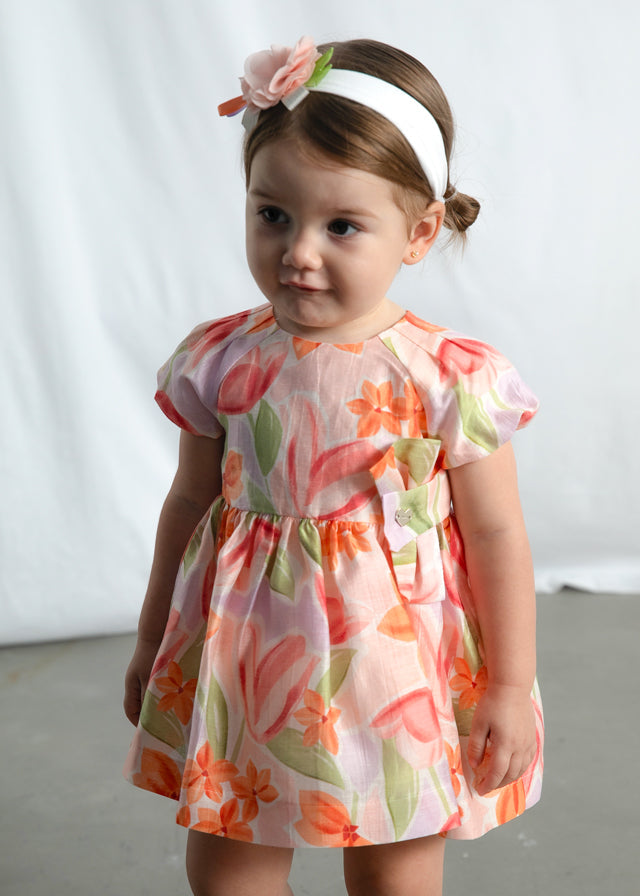 Little girl wearing Mayoral Blossom floral dress, close view
