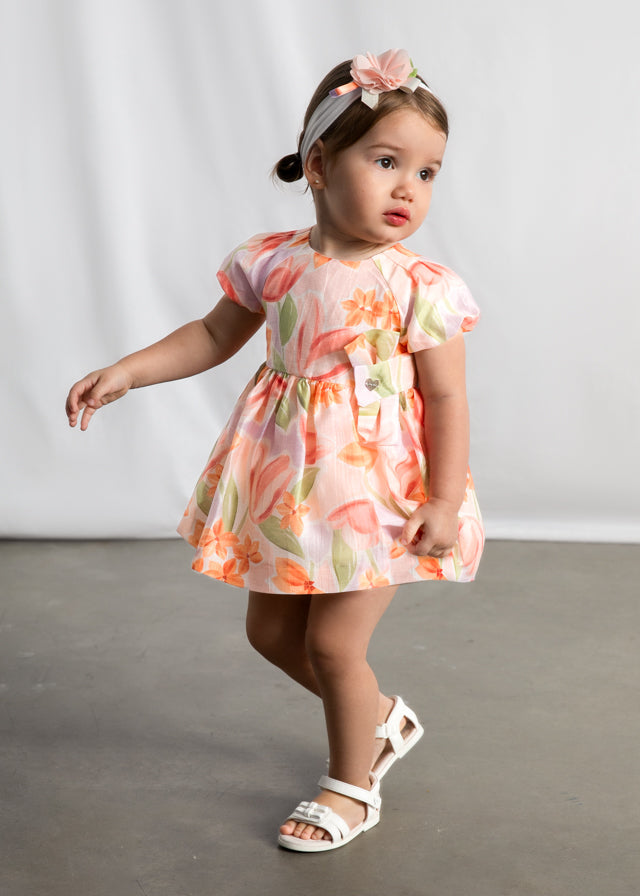 Little girl wearing Mayoral Blossom multicolour floral dress
