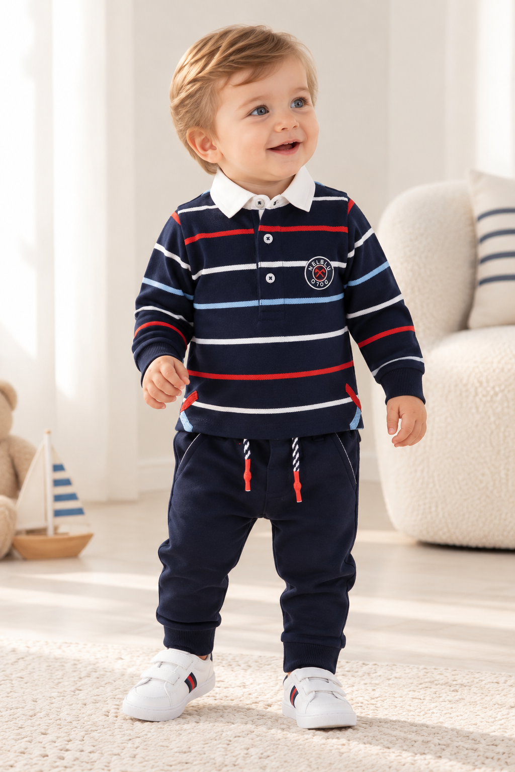 Baby boy wearing Miranda Nel Blu navy stripe polo and joggers set