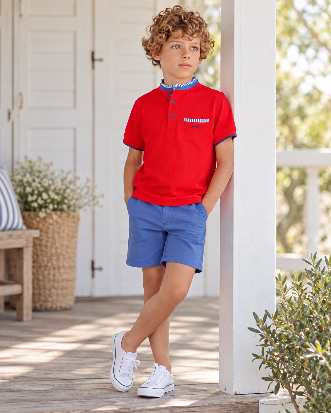 Boy wearing Miranda Nel Blue red polo shirt and blue shorts