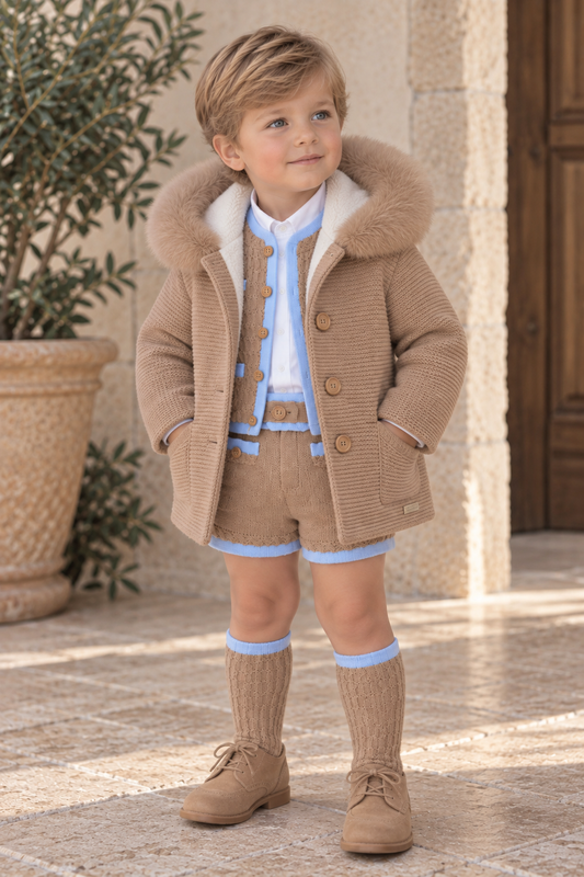 Boy wearing Rahigo camel lined knitted coat with matching camel and blue outfit