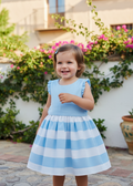 Toddler girl in blue striped dress in Spain